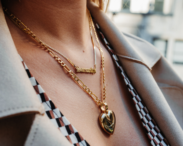personal name necklace, figaro chains, heart picture pendant, and a anchor cable chain