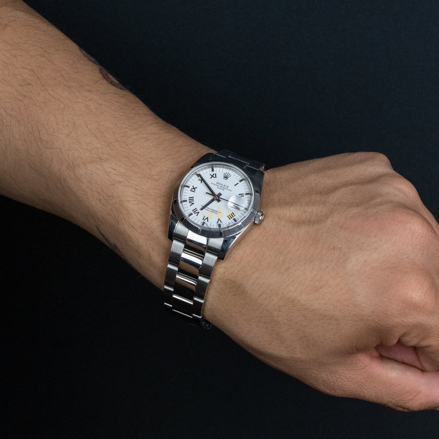 Rolex Oyster Perpetual Date, 34mm, Stainless Steel, Engine Turn Bezel, White Roman Dial, Ref.115210